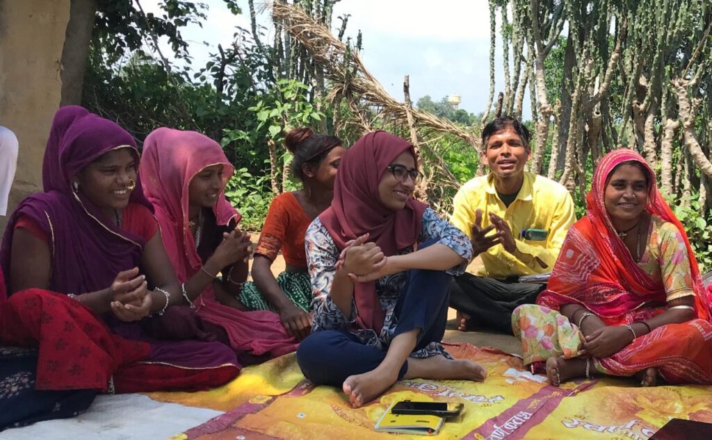 Sofia and her team during a community meeting in Manpur